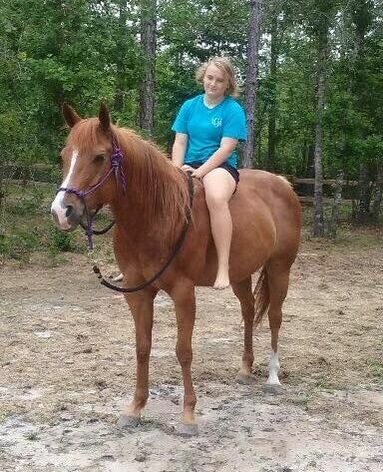 Penny being ridden bareback by her new owner
